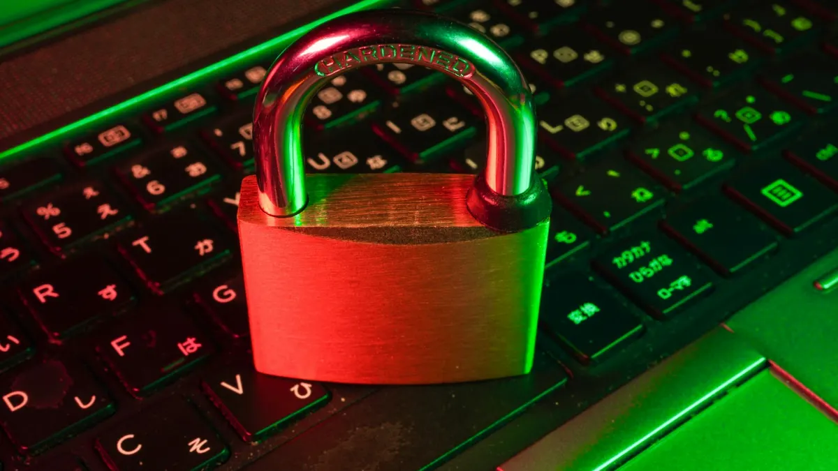 Red padlock on a black keyboard