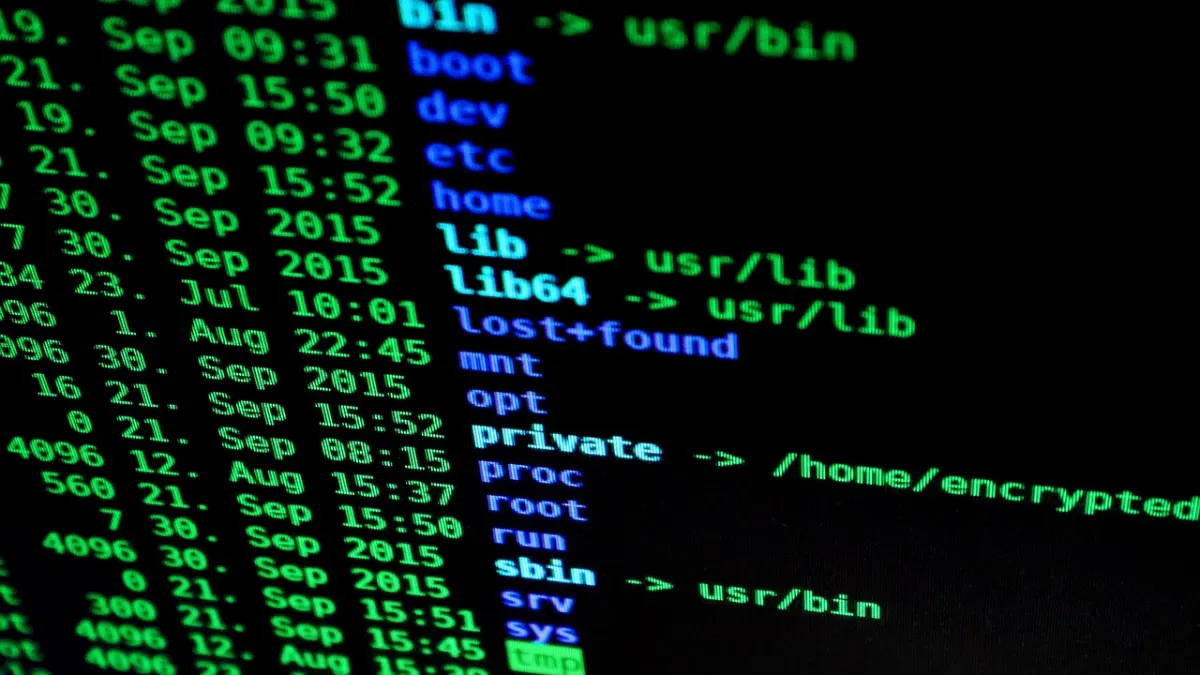 Laptop with code in a dark room